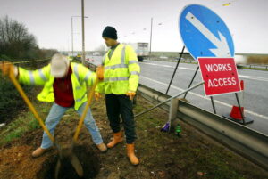 Workmen working on the side of the road