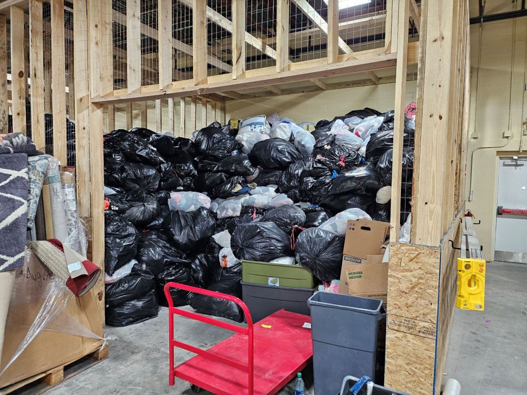 Bags of donated goods before processing